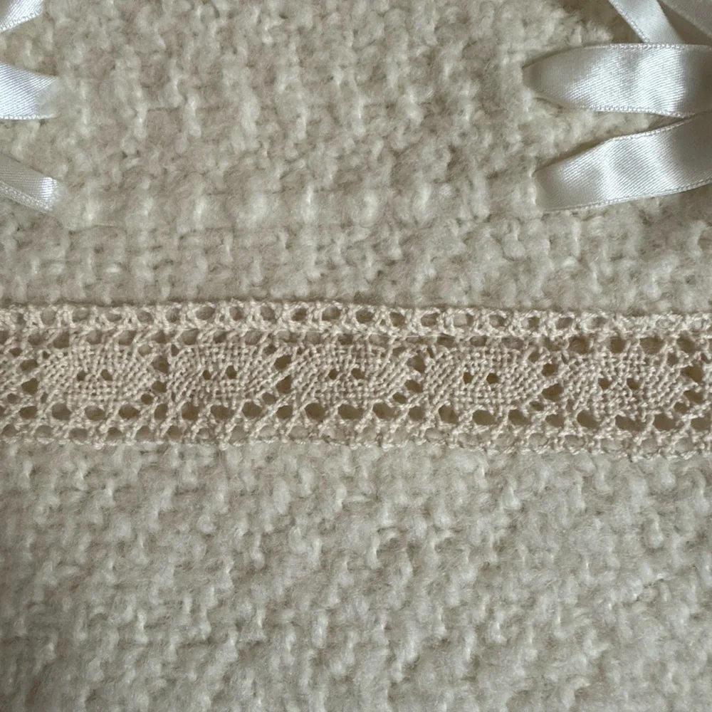 Irish baby blanket by Branigan Weavers Cream color with lace and satin bows